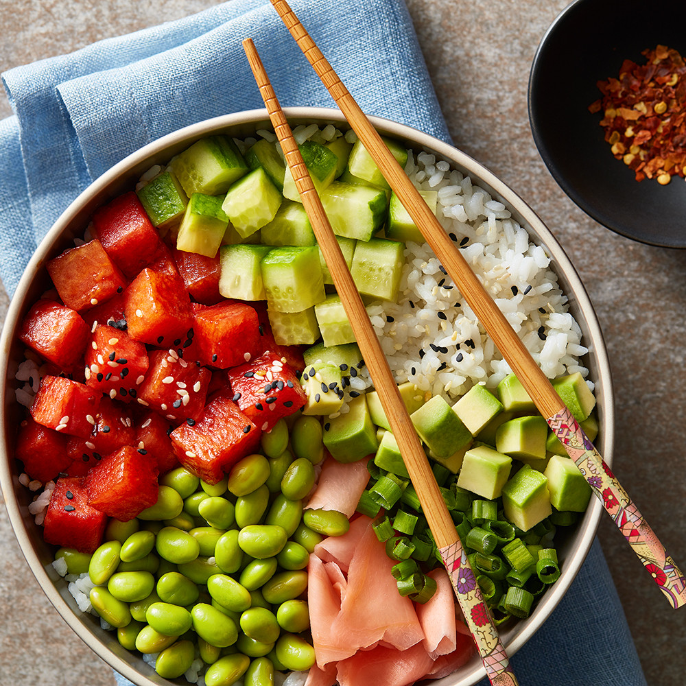 Poke served in bowl with chopped sticks