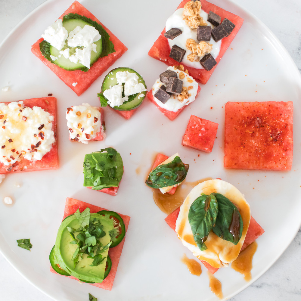 Watermelon flavor pairing flight on a white plate on a white marble background.