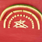 Different cuts of watermelon rind including a half circle, rind sticks, rind cubs and rind small sticks in shape of a rainbow